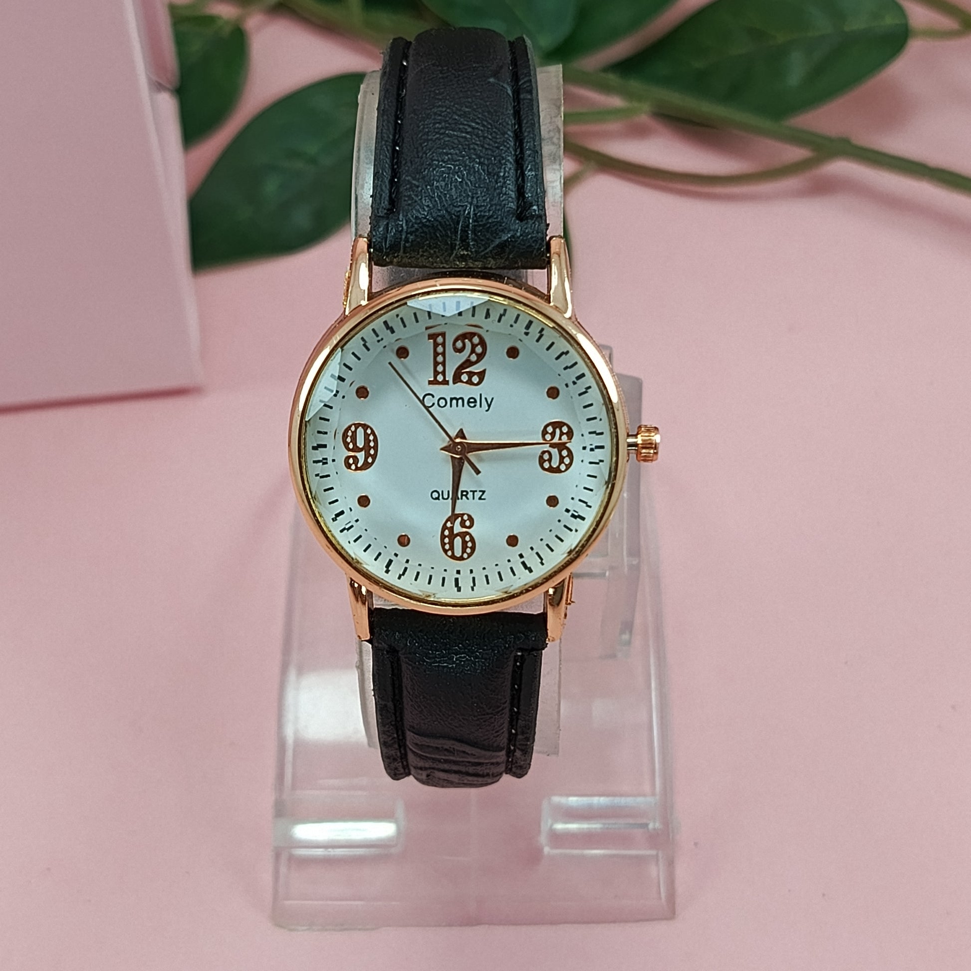 Rose Gold Quartz Watch with Black Leather Strap.