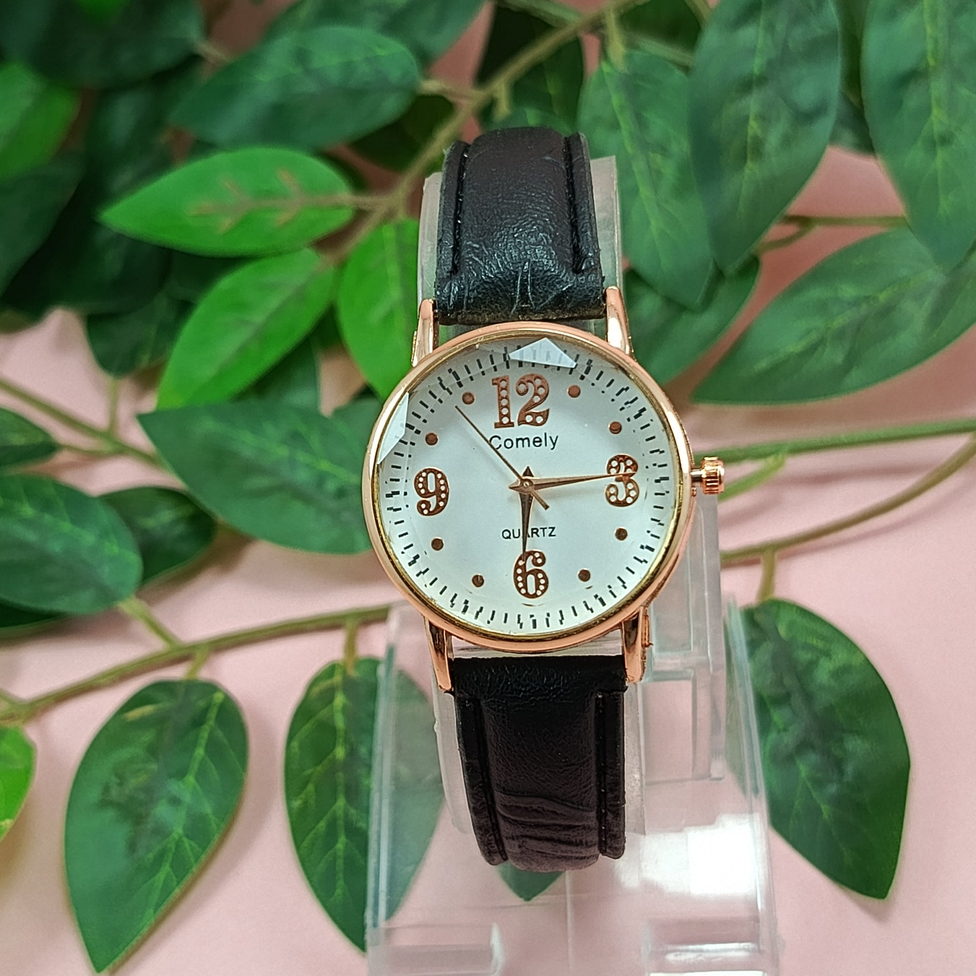 Rose Gold Quartz Watch with Black Leather Strap.