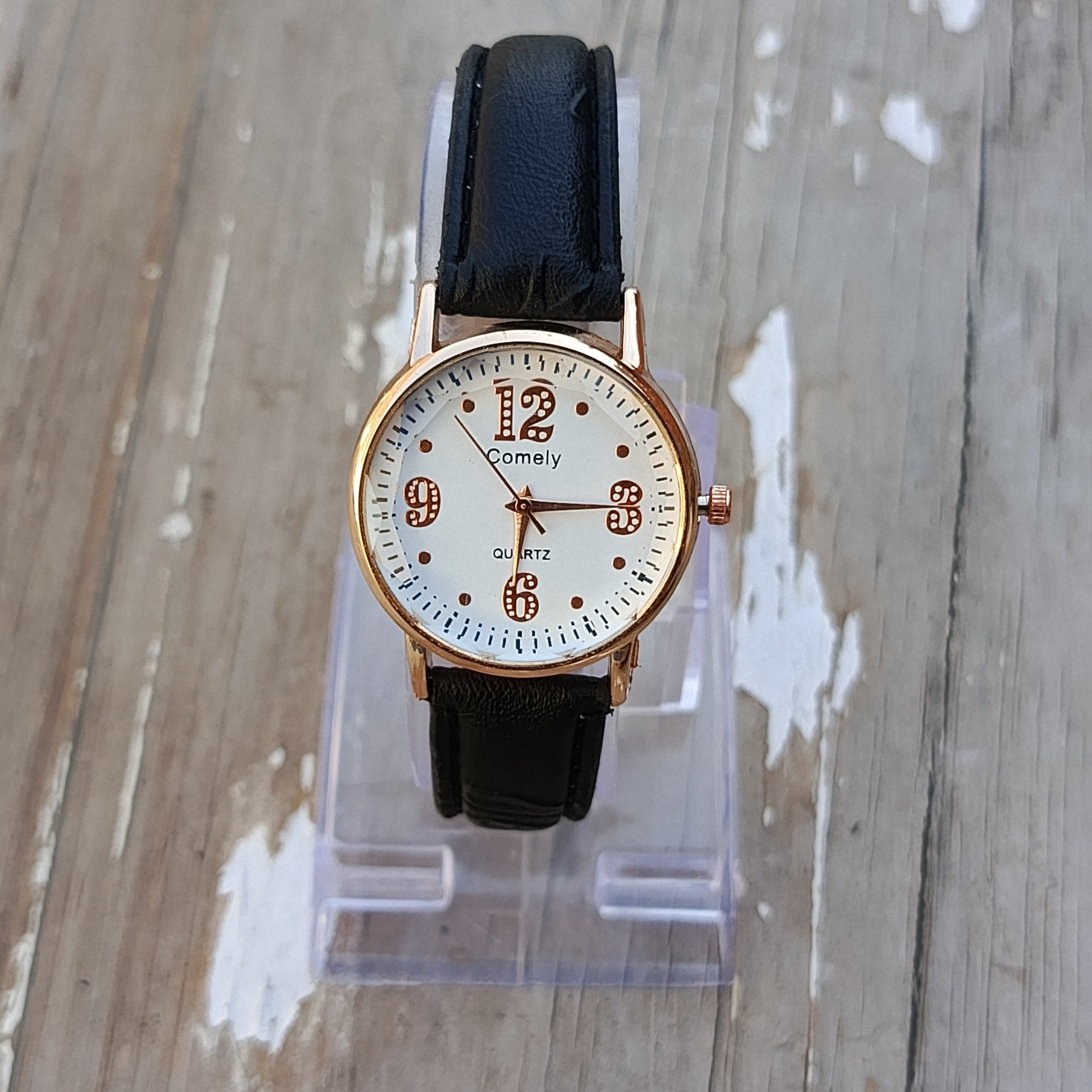 Rose Gold Quartz Watch with Black Leather Strap.