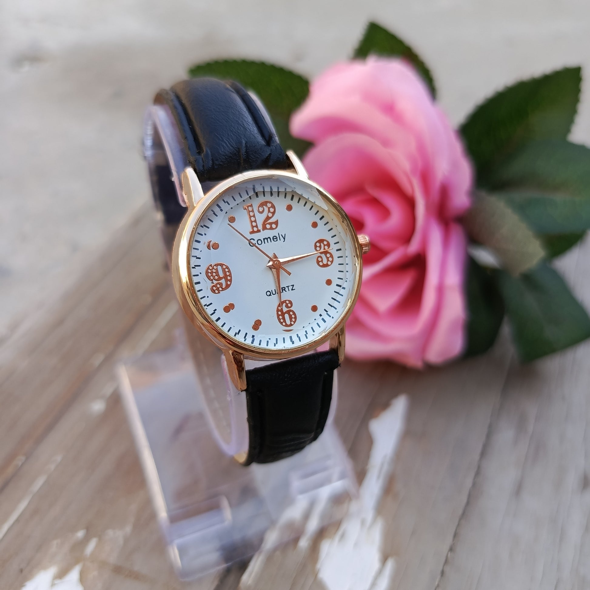Rose Gold Quartz Watch with Black Leather Strap.