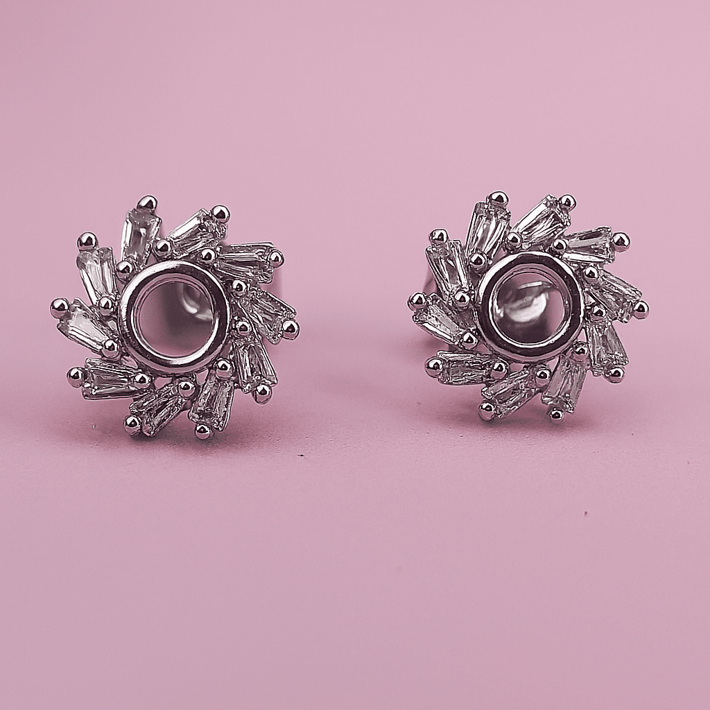 Luxury zircon circular earrings with zircon stones displayed on pink background